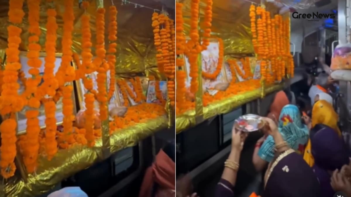 Passengers performing aarti inside a decorated train coach