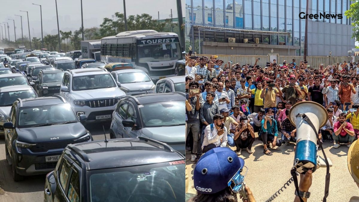 Crowd of workers protesting in Noida with police presence